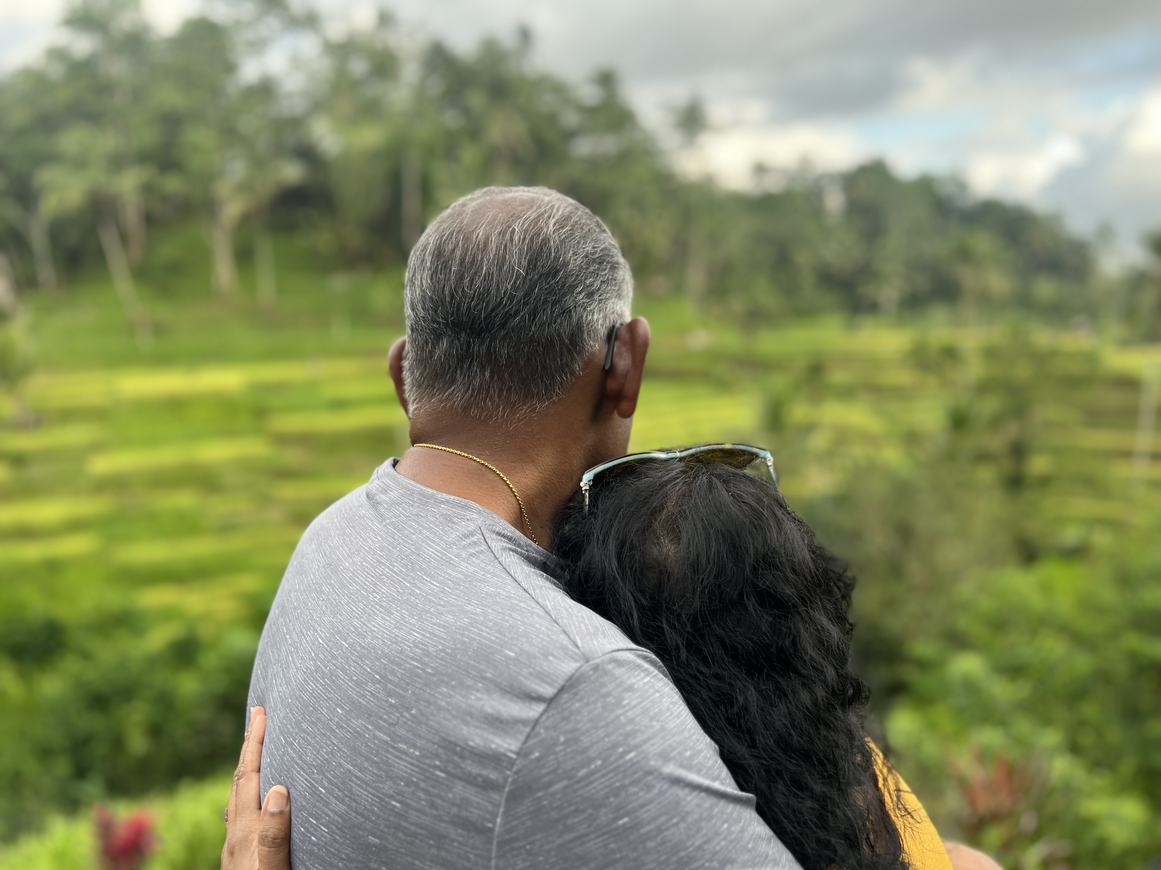 Robert and Ruky sharing a quiet moment overlooking the landscape