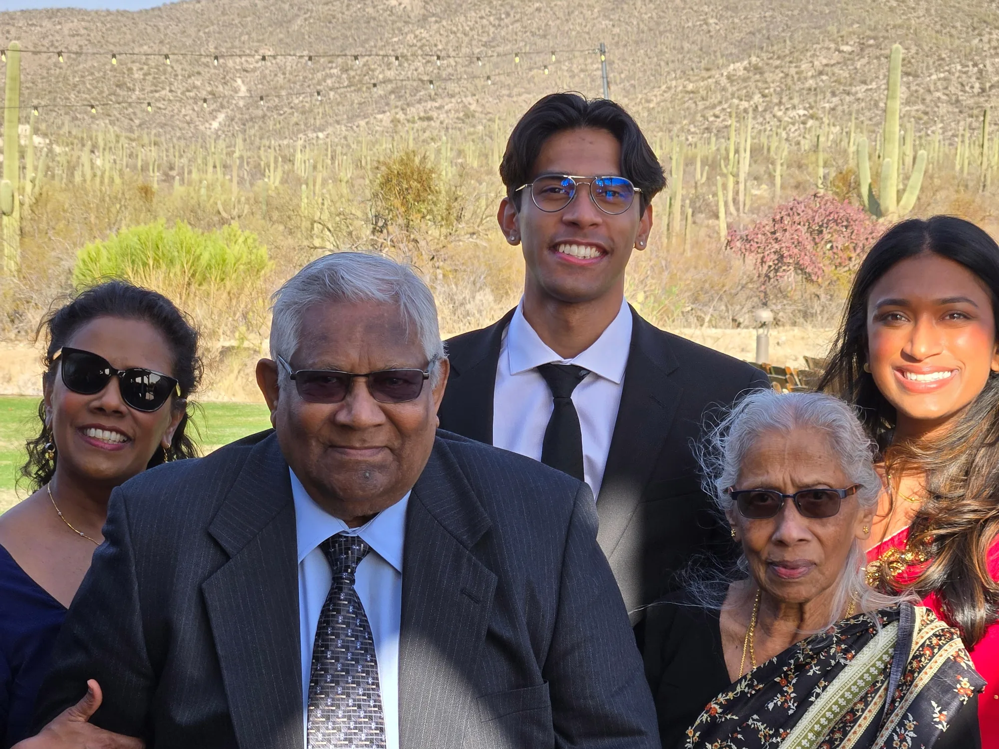 Family members gathered outdoors for a portrait